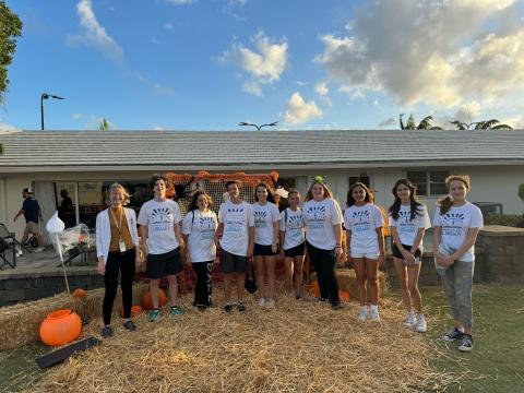 A group photo of the Teen Advisory Board volunteers at Halloween at the Park.