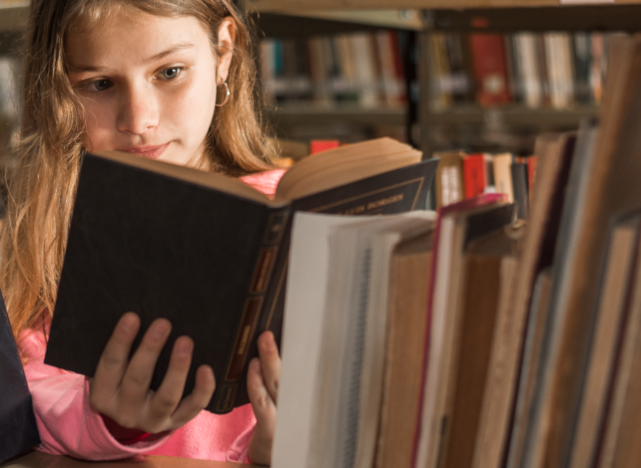 Girl reading at the library